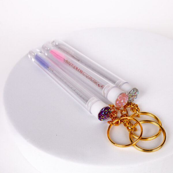 Key ring with mascara wand